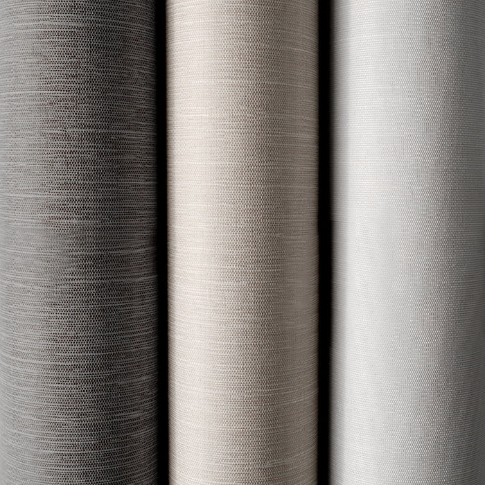 Close-up of three different gray fabric swatches with varying textures.