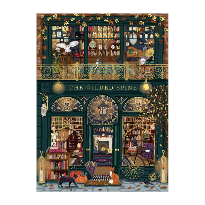 Experience Sally Wilsonโs The Gilded Spine 1000 Piece Foil Puzzle, featuring a whimsical bookstore with two book-filled floors, arched windows, golden accents, fall leaves, and cozy autumn vibesโplus charming cats outside.