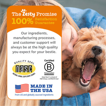 Person in blue shirt holding tan dog with mouth open next to orange and white product information card with quality seals and