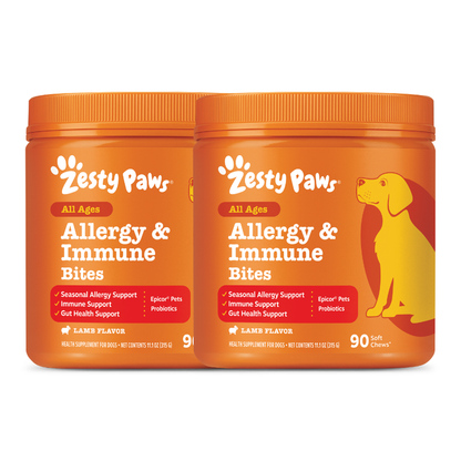 Two orange Zesty Paws Allergy & Immune Bites containers with lamb flavor and yellow dog illustration on right jar.