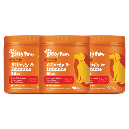 Three orange jars of Zesty Paw Allergy & Immune Bites with yellow dog silhouettes and lamb flavor labels.