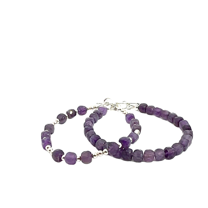 Two beaded gemstone bracelets with Amethyst stones and silver accents, displayed against a white background, front overview.