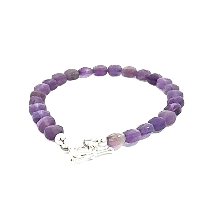A beaded Amethyst faceted coin gemstone bracelets with a sterling silver toggle, displayed against a white background, back overview.