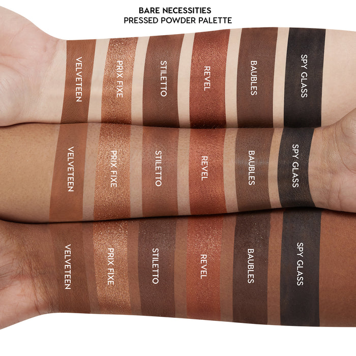 Swatches of Bare Necessities ColourPop Shadow Palette (pressed powder) on three arms, showing matte and shimmer neutrals: Velveteen, Prix Fixe, Stiletto, Revel, Baubles, Spy Glass, striped across light to deep skin for shade comparison.