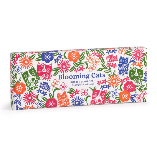 A rectangular box by Tara Lilly features cat and floral designs with Blooming Cats Rubber Stamp Set, 11 Stamps + 4 Ink Pads in blue and pink text.