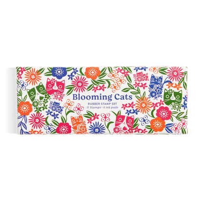 The Tara Lilly Blooming Cats Rubber Stamp Set features playful cat and floral motifs in red, blue, orange, green, and purple on a crisp white box.