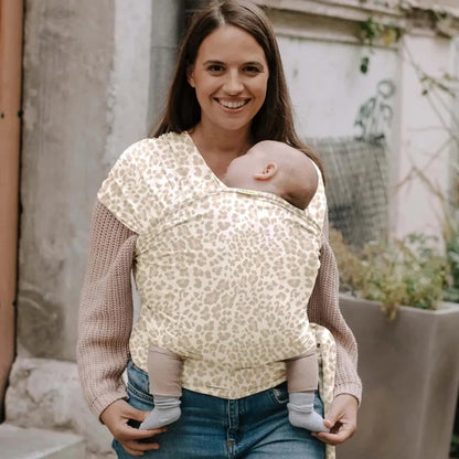 A Boba Classic Baby Wrap, made from a soft 95% French Terry cotton blend and 5% Spandex. Ergonomic, award-winning design fits babies from 7 Ibs to 35 Ibs, best up to 20 Ibs. Machine washable, dryer friendly, and certified hip-healthy. Sand Leopard