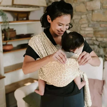 A Boba Classic Baby Wrap, made from a soft 95% French Terry cotton blend and 5% Spandex. Ergonomic, award-winning design fits babies from 7 Ibs to 35 Ibs, best up to 20 Ibs. Machine washable, dryer friendly, and certified hip-healthy. Sand Leopard