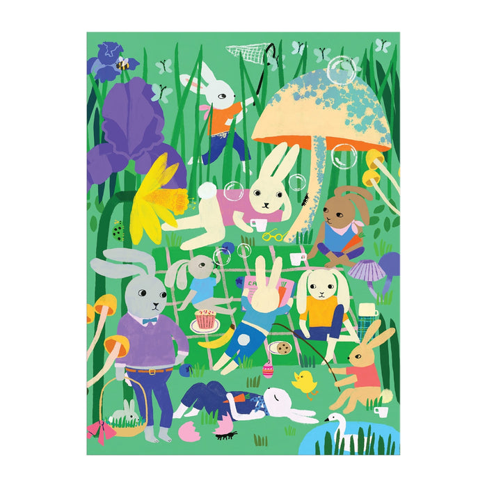 Experience a lively, whimsical scene with the Bunny Daydream 1000 Piece Puzzle by Anne Bentley—rabbits play, read, picnic, and blow bubbles among flowers and mushrooms in a colorful grassy field.