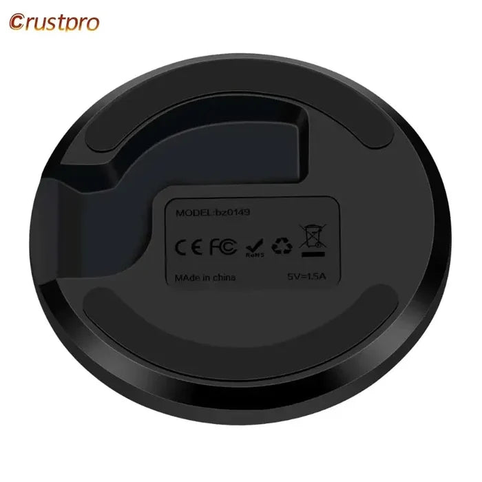 A close up of a black robot vacuum cleaner on a white background
