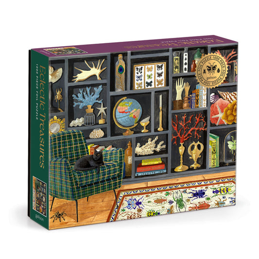 The Eclectic Treasures 1000 Piece Foil Puzzle by Mélanie Voituriez features an illustrated bookshelf of curiosities, a black cat on a green plaid chair, and precision-cut pieces that fit snugly.