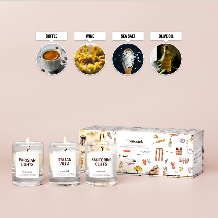 Three mini candles labelled "Sanitorini Cliffs", "Italian Villa", and "Parisian Lights" and featured notes of "Coffee", "Wine", "Sea Salt", are "Olive Oil"