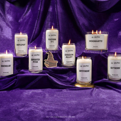 A group shot of all the products part of the Homesick x Harry Potter collaboration. They are shot on a silky purple fabric.