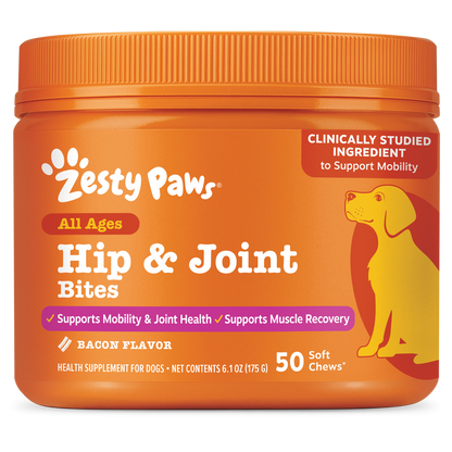 Orange plastic container of Zesty Paws Hip & Joint Bites for dogs with yellow dog illustration and bacon flavor label.