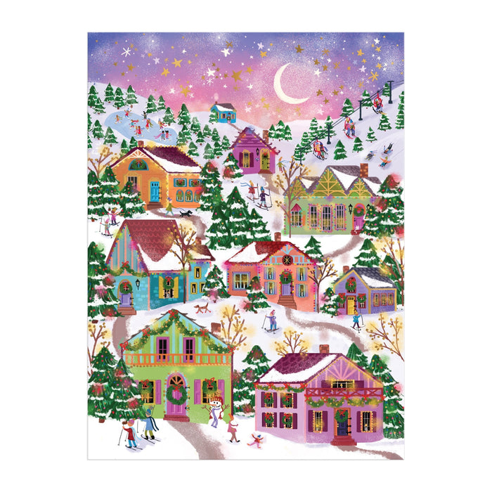 The Joy Laforme Snowcap Village 1000 Piece Foil Puzzle features a colorful village at dusk with pastel houses, snow-covered trees, and joyful skaters, beautifully accented by foil under a crescent moon and starry sky.