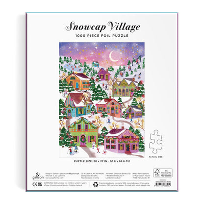 The back of the Joy Laforme Snowcap Village 1000 Piece Foil Puzzle box shows a vibrant winter village with snow-covered houses, skaters, and a starry sky, highlighting stunning foil details from the Joy Laforme brand.