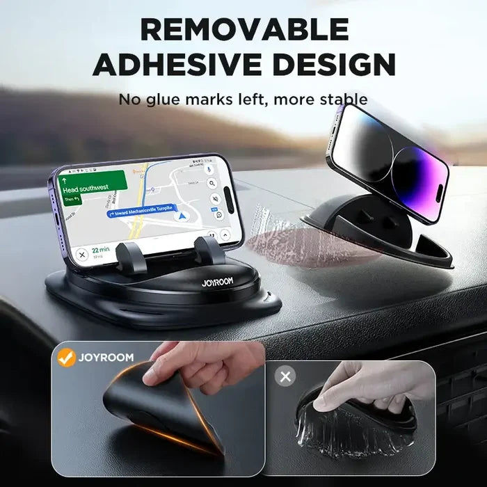 The car phone holder is attached to the dashboard