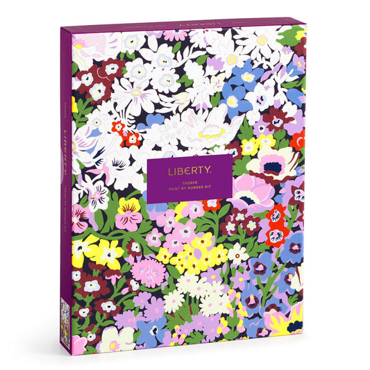 A colorful box with a purple border displays Liberty 9 x 12 Paint by Number Kit Thorpe by Liberty London in gold lettering, featuring vibrant floral designs inspired by the Thorpe pattern.