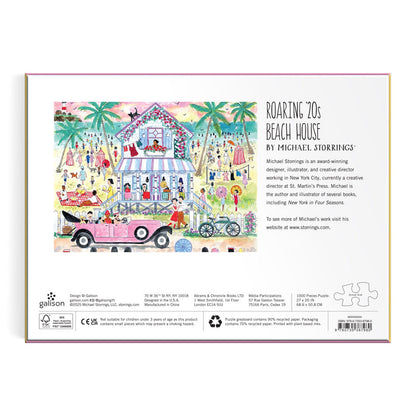 Back of the Michael Storrings Roaring 20s Beach House 1000 Piece Puzzle box shows a vibrant 1920s beach scene with people, palm trees, and a vintage car, plus puzzle title, artist bio, and product details.