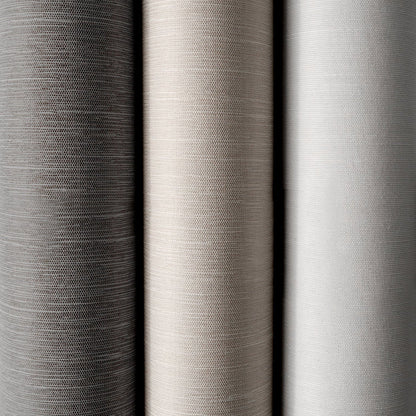 Close-up of three different gray fabric swatches with varying textures.