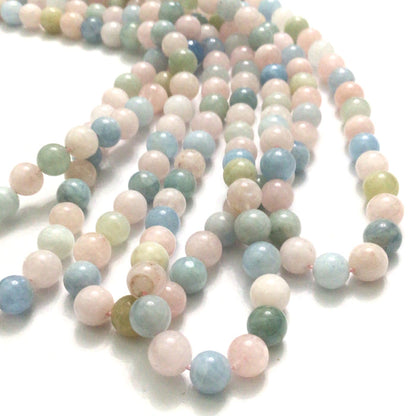 6mm Morganite gemstone strand with soft pink, blue, and  peach hues round smooth 16'' strands  on a white background, front overview.