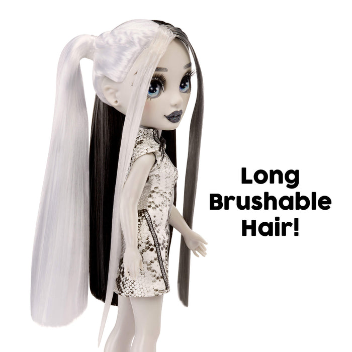 Doll with long brushable hair and sequin outfit on a white background