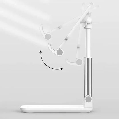 A white stand with a lamp and a phone on it