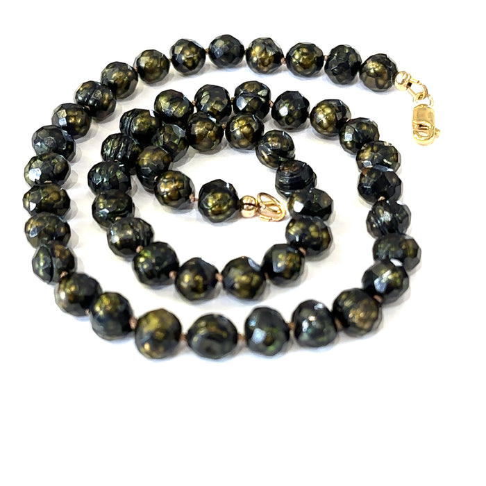 Healing freshwater pearl necklace with 7mm faceted irregular round pearls  on white spiral center view