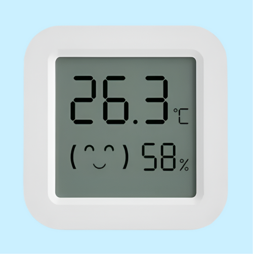 Digital thermometer and hygrometer display showing temperature and humidity.