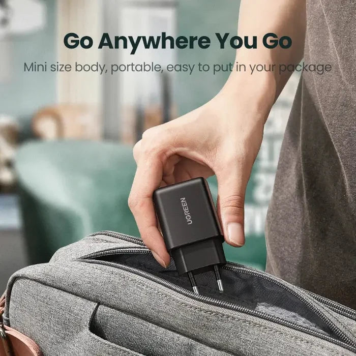 A person holding a bag with a usb attached to it