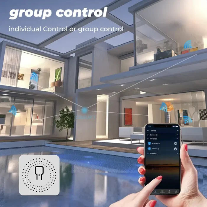 A person holding a cell phone in front of a house